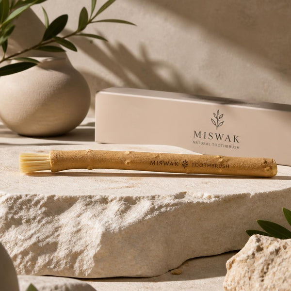 gpt-image-2_A_luxury_cinematic_product_photo_of_a_natural_Miswak_toothbrush_placed_on_beige_-0.jpg